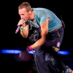 Chris Martin Honors Swifties with “Love Story” Cover After Vienna Terror Plot